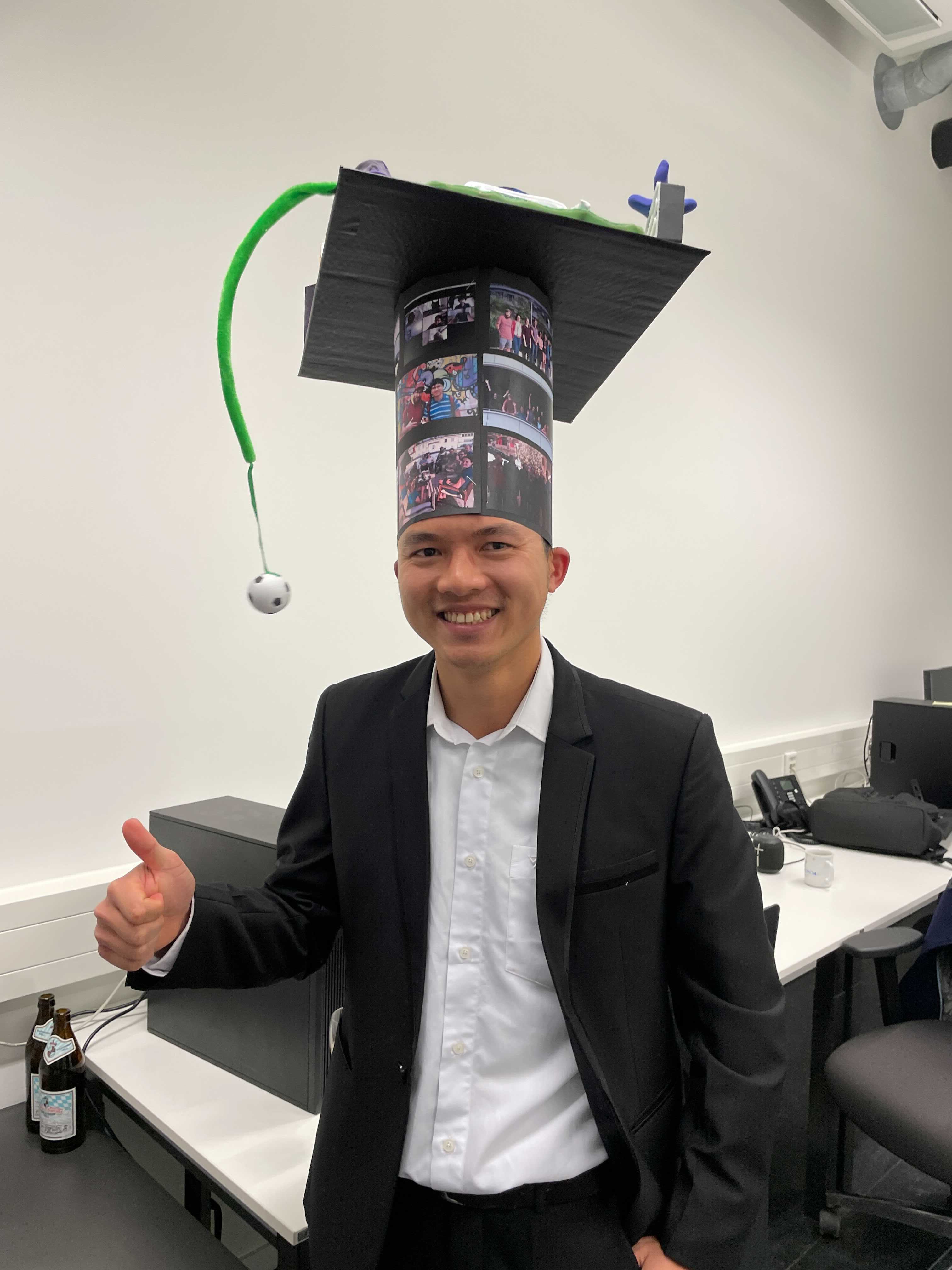 Hoan proud of XL hat after PhD defense