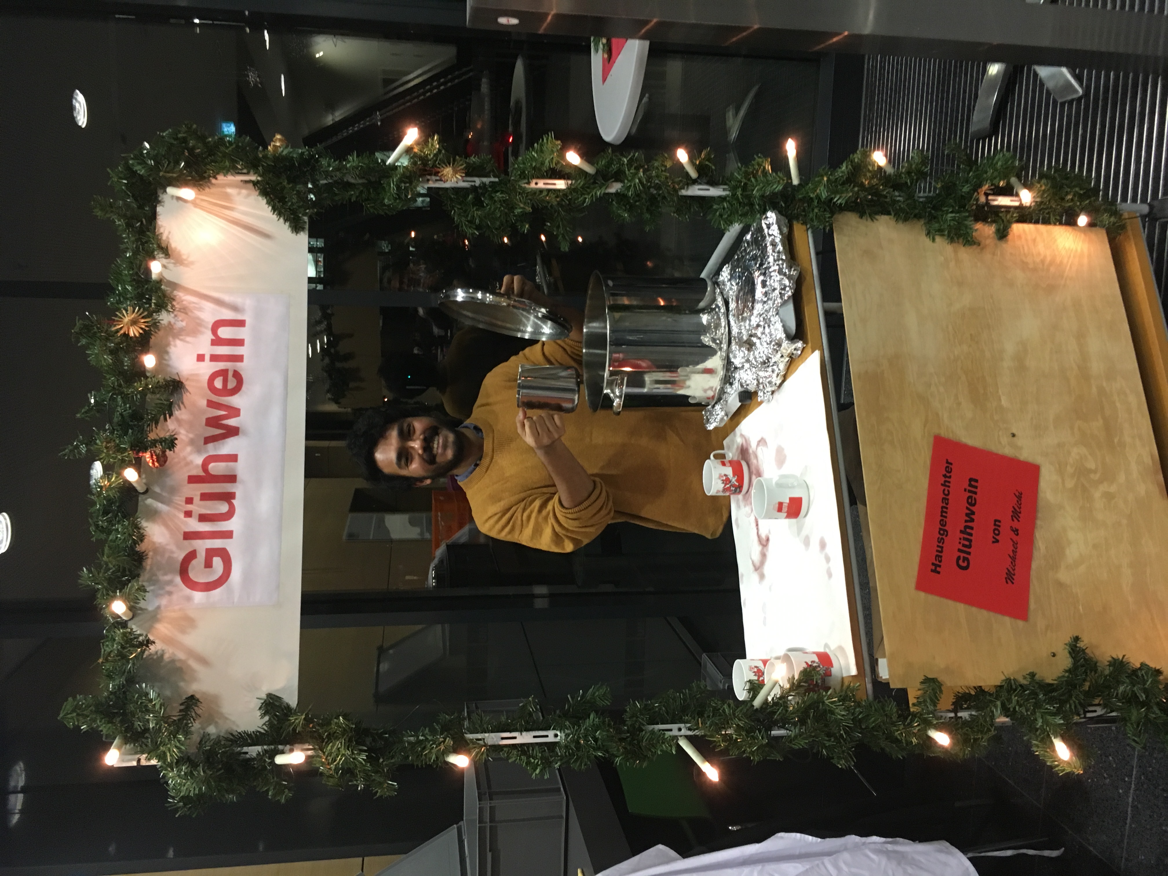 Shounak serving Gluehwein at Christmas party 2017